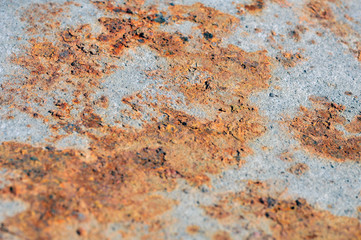 Orange rust on the metal surface.