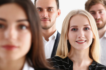 Obraz premium Group of smiling people stand in office looking in camera portrait. White collar power mediation solution project creative advisor participation profession train bank lawyer client visit concept