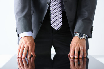 Obraz premium Empty arms of man in suit and tie closeup. White collar banker time watch wristwatch patience make decision strong control head of the board council concept