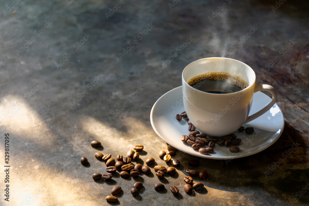 Wall mural coffee cup coffee beans on the cement background with smoky aroma