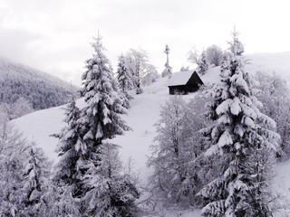 Wooden House in the winter mountains - Snowy forest Winter wonderland in Capathian Mountains