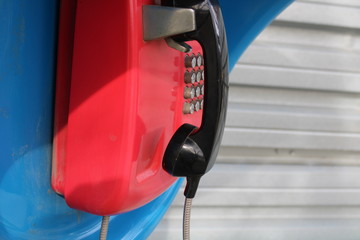 red telephone receiver on the street