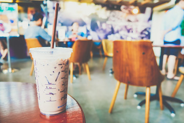 Ice cappuccino coffee drink in modern cafe