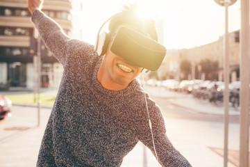 Young mixed race man outdoor using 3d viewer