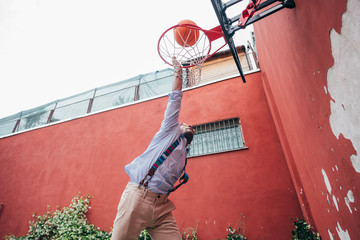 Young mixed race man outdoor dunking playing basketball © Eugenio Marongiu