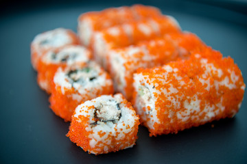 Japanese food. Sushi. Philadelphia roll with fresh salmon, cucumber, avocado, cream cheese, tobiko caviar. Sushi menu. Top view