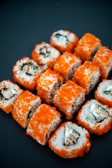 Japanese food. Sushi. Philadelphia roll with fresh salmon, cucumber, avocado, cream cheese, tobiko caviar. Sushi menu. Top view