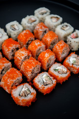 Japanese food. Sushi. Philadelphia roll with fresh salmon, cucumber, avocado, cream cheese, tobiko caviar. Sushi menu. Top view