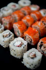 Japanese food. Sushi. Philadelphia roll with fresh salmon, cucumber, avocado, cream cheese, tobiko caviar. Sushi menu. Top view