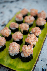 Japanese food. Sushi. Philadelphia roll with fresh salmon, cucumber, avocado, cream cheese, tobiko caviar. Sushi menu. Top view