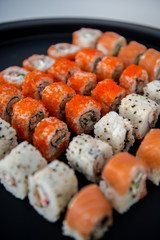 Japanese food. Sushi. Philadelphia roll with fresh salmon, cucumber, avocado, cream cheese, tobiko caviar. Sushi menu. Top view