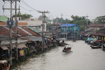 local vendor sell the product on the river in Damnoen Saduak Floating Market