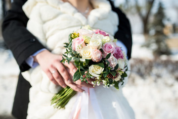 beautiful wedding rings lie in a special stand and wait until they are put on