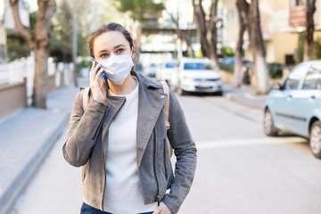 Fototapeta premium Young woman in medical face protection mask