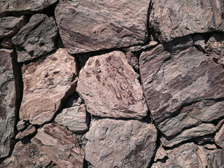 Stones stacked to a wall - structures as background