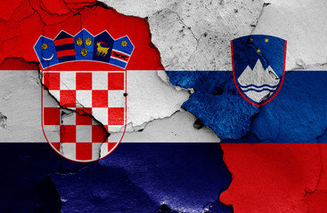 flags of Croatia and Slovenia painted on cracked wall