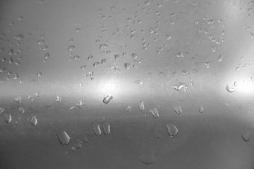 drops on a metal surface. Abstract background template can be used as a wall paper screen saver page cover