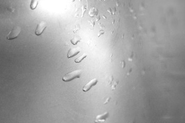 drops on a metal surface. Abstract background template can be used as a wall paper screen saver...