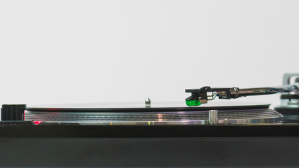 Close-up of modern turntable vinyl record player with music plate. Needle on a vinyl record.