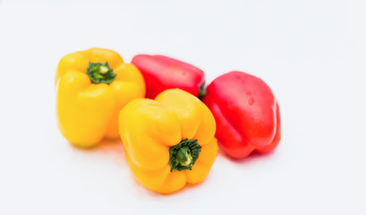 yellow and red peppers food on white background