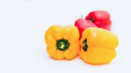 yellow and red peppers food on white background