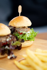 Elegant mini burgers served with french fries