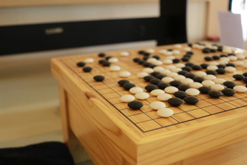 Checkers on a wooden board. Checkers are an activity that is a practice of thinking skills and good concentration.