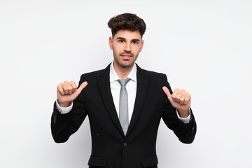 Young businessman over isolated white background proud and self-satisfied