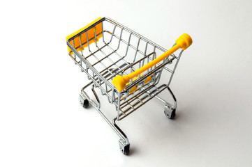 Cart for shopping yellow on a white background. Concept holiday shopping, sales, prices and...