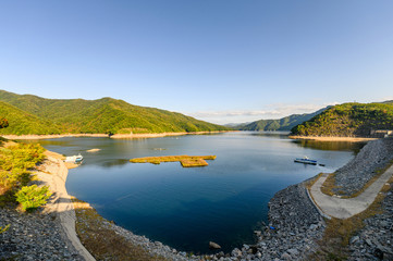 Soyanggang Dam with Soyang river and blue sky in valley on sunny