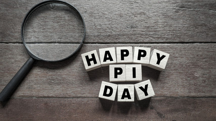 inspirational of Pi Day celebration - text happy pi day written on wooden block 