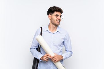 Young architect man over isolated white background laughing