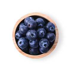 Blueberry in a wooden cup Isolated on a white background. Top view