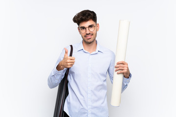 Young architect man over isolated white background giving a thumbs up gesture