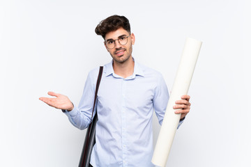 Young architect man over isolated white background extending hands to the side for inviting to come
