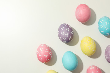 Fototapeta na wymiar Multicolor Easter eggs on white background, space for text