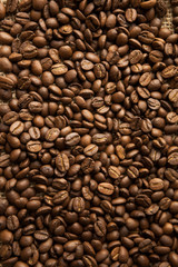 Roasted Arabica beans close up, coffee background