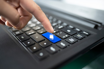 closeup of male hand typing on keyboard