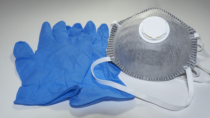 Set of FFP2 medical masks and disposable blue medical gloves. Face mask protection against pollution, virus, flu and coronavirus. Health care and surgical concept