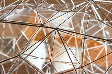 Futuristic shelter. Close up shot of an abstract model, steel wire and glass structure very similar to a neural web, contemporary architecture icon. Connectivity, network, modern art. 