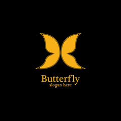 Golden butterfly on black background.logo template for beauty salon,spa salon,etc.