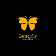 Golden butterfly on black background.logo template for beauty salon,spa salon,etc.