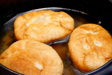 Frying pies, pasty on a pan. Patties in the pan. Homemade hot cakes pasty . Fried patties.Pasties on frying pan.