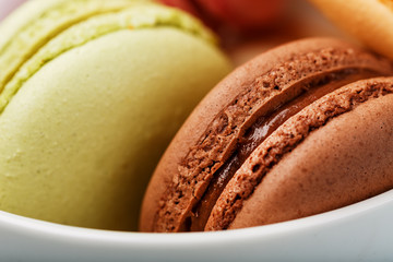 Macaron cookies with different color filling close-up, macro.