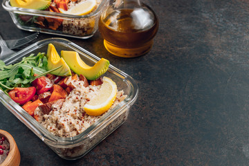 Vegetarian healthy meal prep containers . Raw vegetables and quinoa for lunch on dark table. Vegan, healthy, detox food concept. Selective focus