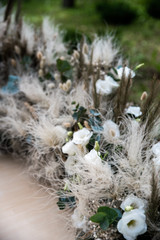 fluffy spikelets, flowers and candles on the floor