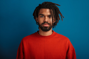 Portrait of handsome african american man posing and looking at camera