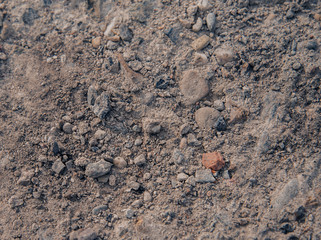 background with multicolored stones,gray, dirty background with stones of different shapes,concrete wall texture
