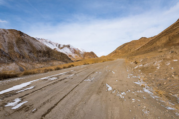 the gravel road on the snow mountain
