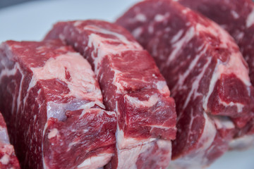 sliced beef steaks closeup. raw beef for grilling.